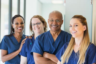 Man leading team of multi-ethnic nurses