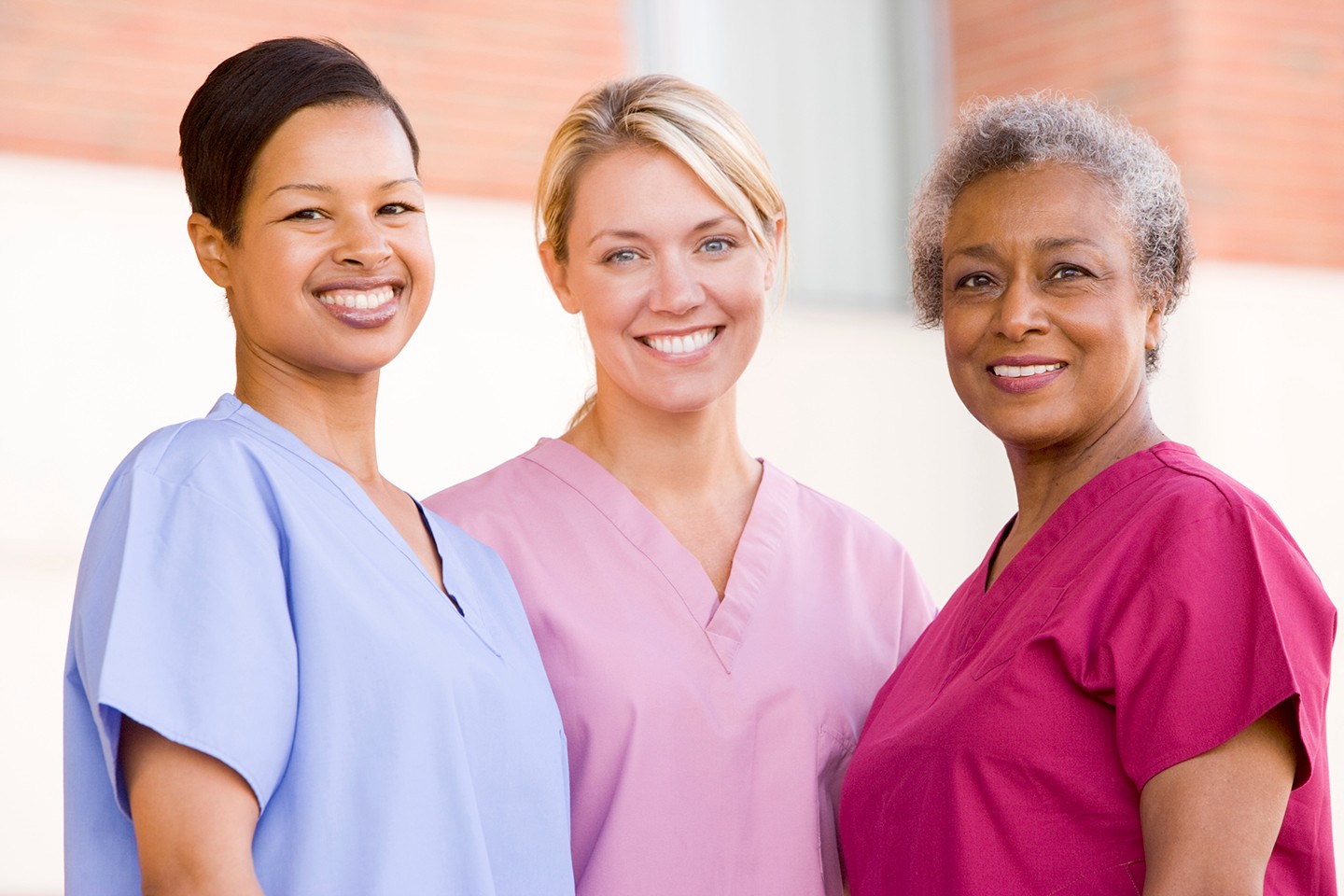 Three nurses smiling